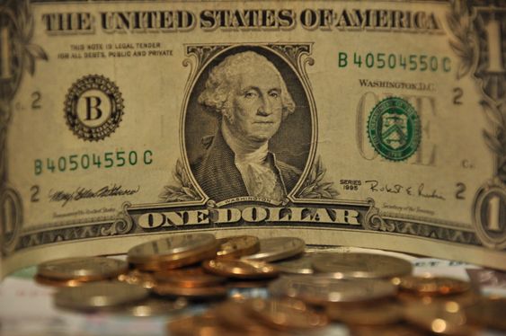 One dollar USA and Russian coins.