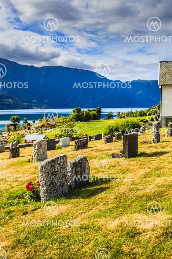 Churchyard in Nes village at fjord, Norway