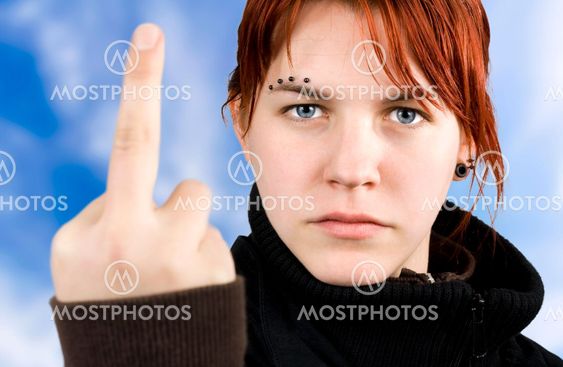 Angry girl showing middle finger