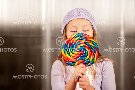 Little girl with a lollipop