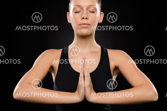 Portrait of young Caucasian woman exercising yoga