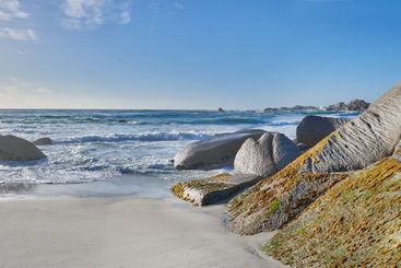 Beach, rocks and holiday in nature, waves and location...