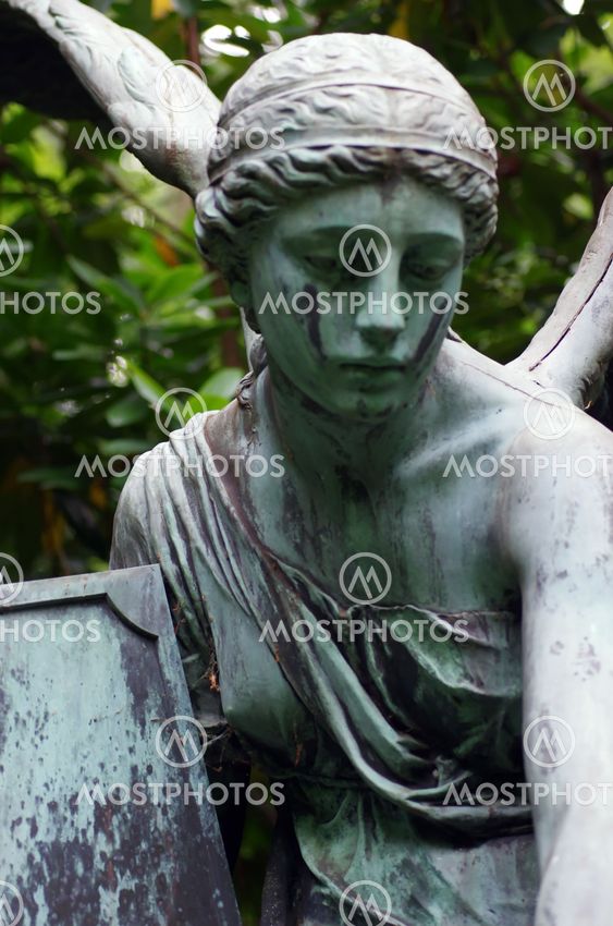 detail of an old marble fombstone