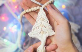 Handmade crochet new year decoration in woman hands....