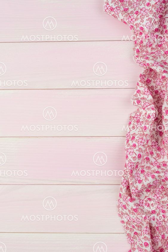 Pink towel over wooden table