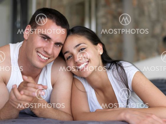 couple relax and have fun in bed