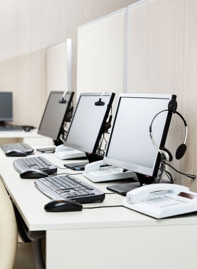 Computers With Headphones At Office