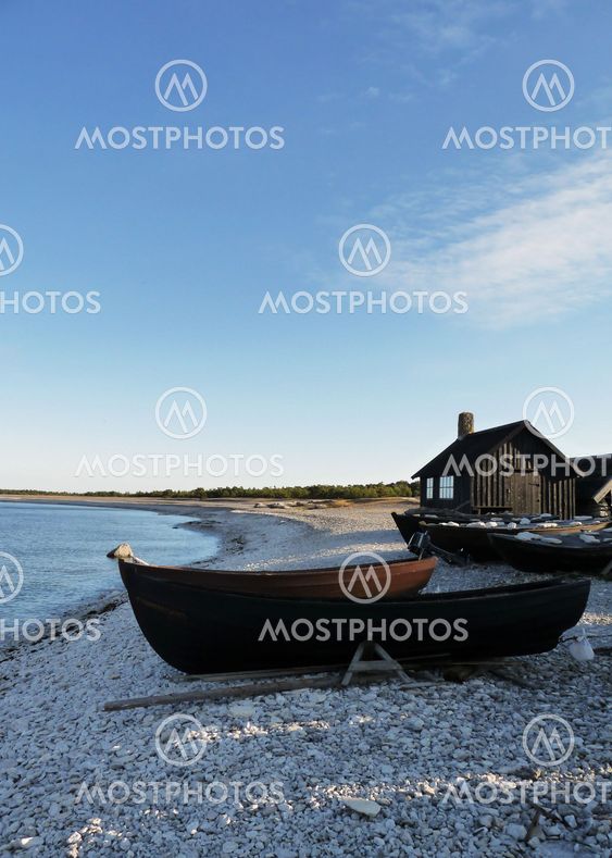 Rowboat on rocky shore