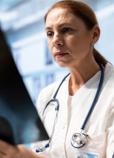 Doctors with expertise discuss x ray scans results in a...