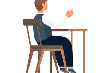 A Person Sitting at a Desk Pointing