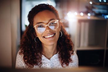 Happy, night and portrait of businesswoman in office for...