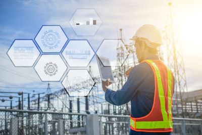 Engineer Holding tablet technology data system network...