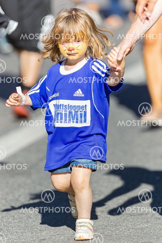 Young girl holding dads hand at the Minimil for the...