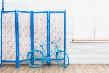 Blue wooden decorating screen with textile panels