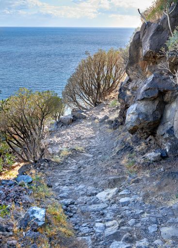 Mountain, trail and landscape with path, ocean and...