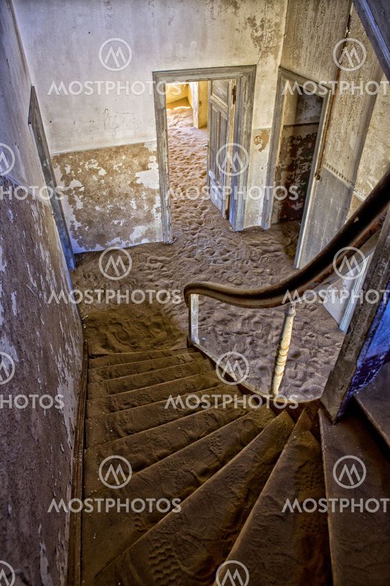 a staircase of an abandonned house at kolmanskop near luderitz