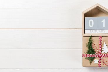 Calendar with date 1 january and gift boxes on color...