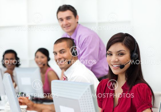 Positive business people with headset on working