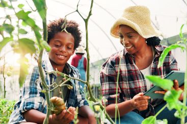 Mother, child and farming in greenhouse, learning and...