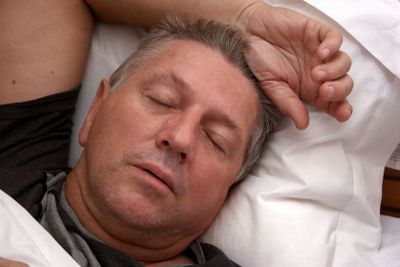 Man sleeping in bed