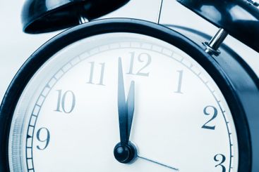 Close up of a black vintage alarm clock