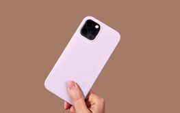 Woman holding latest generation purple smartphone on...