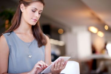 Business, tablet and woman events coordinator at venue...