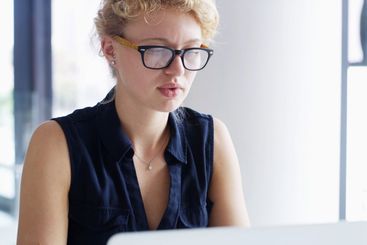 Business, laptop and woman in office, online reading and...