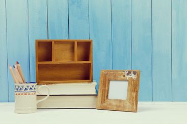 Wooden items of home decor close up on blue wooden...