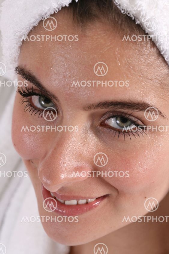 Wet faced girl in towel