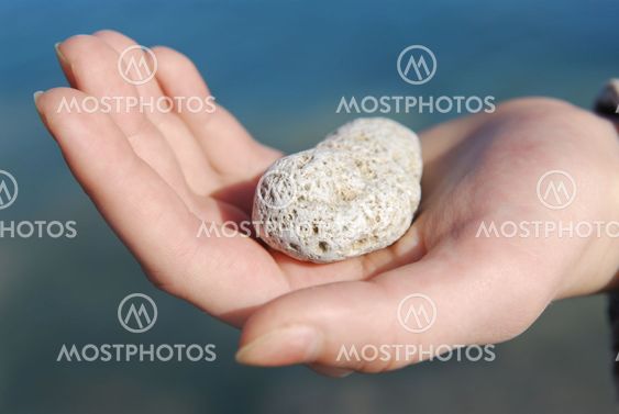 Hand with stone