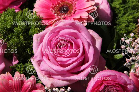 Pink rose in a bridal arrangement