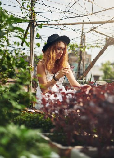 Outdoor, woman and relax with smile in garden, spring...