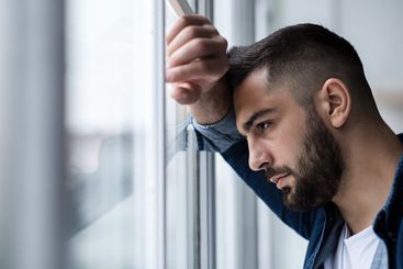 Depressed caucasian man losing job and heartbroken at...