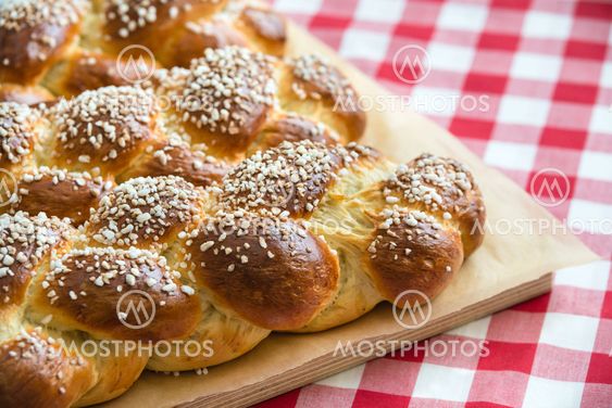Freshly baked sweet braided bread loafs