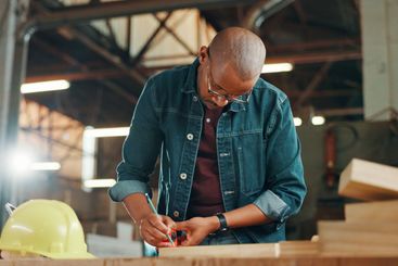 Measuring tape, woodwork and writing with carpenter man...