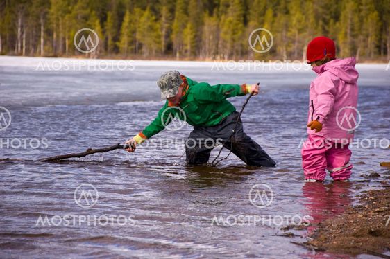 two kids playing in the water