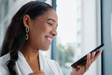 Business woman, tablet and reading in hallway at modern...