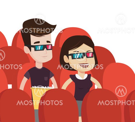 Happy couple watching 3D movie in the theatre.