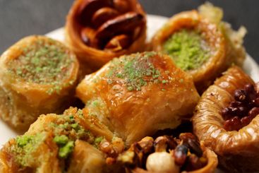 Delicious assortment of traditional sweets displayed on...