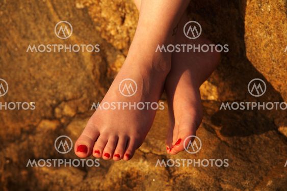 Women's feet in the evening light