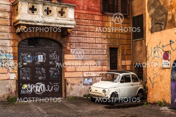 White retro car in italian yard