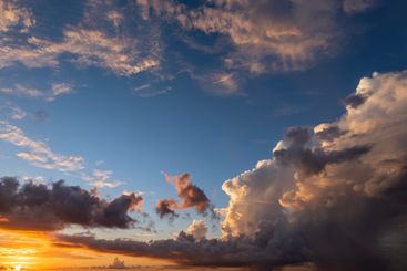 Bright colorful orange and yellow clouds on horizon....
