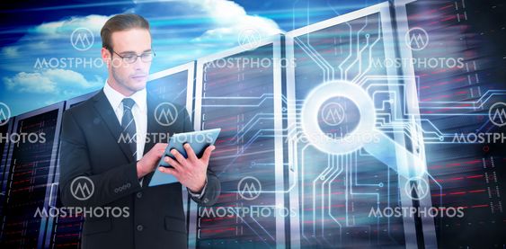 Composite image of unsmiling businessman using tablet pc