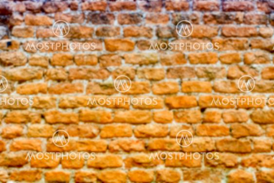 Defocused background of stone brick wall texture with copy space