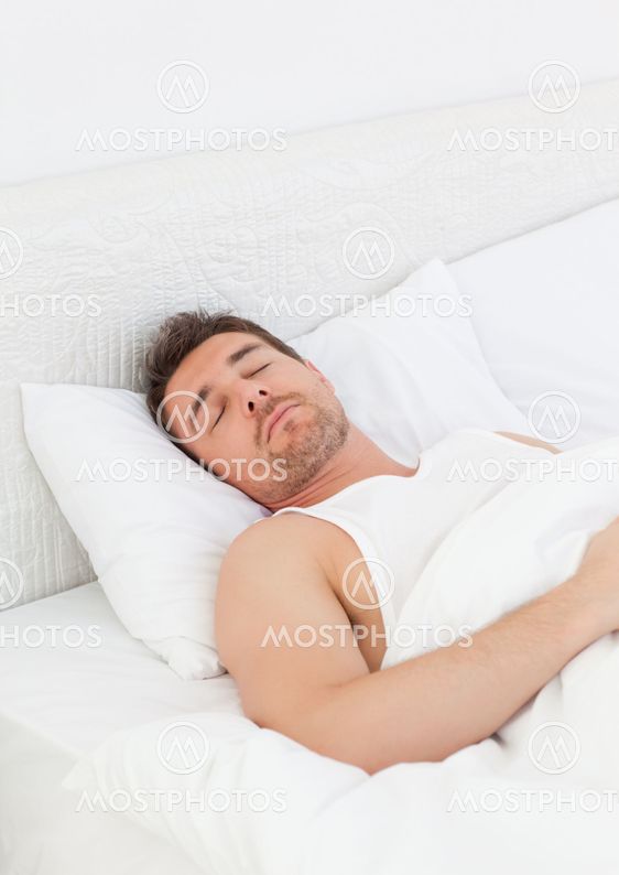 A man in his bed before waking up