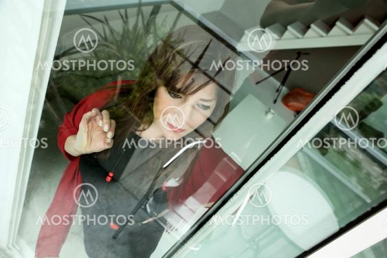 Mature woman looking out the window
