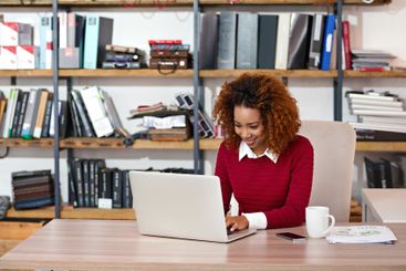 Office, laptop and business woman at publishing agency...
