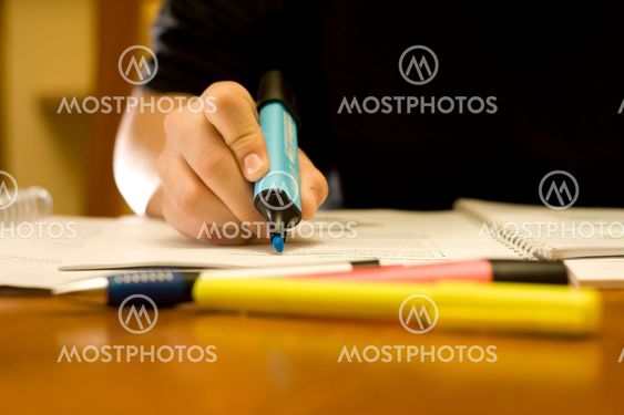 Close-up of a student using the marker pen