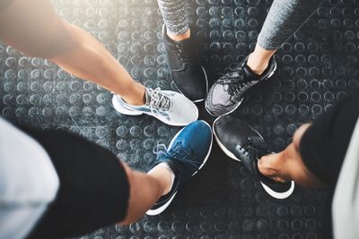 Life is better in gym shoes. a group of people standing...